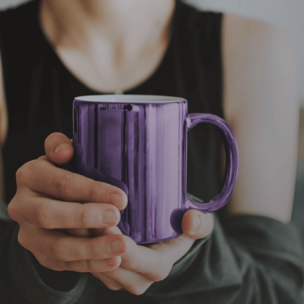 Woman holding a cup of cafe subito micro ground instant coffee