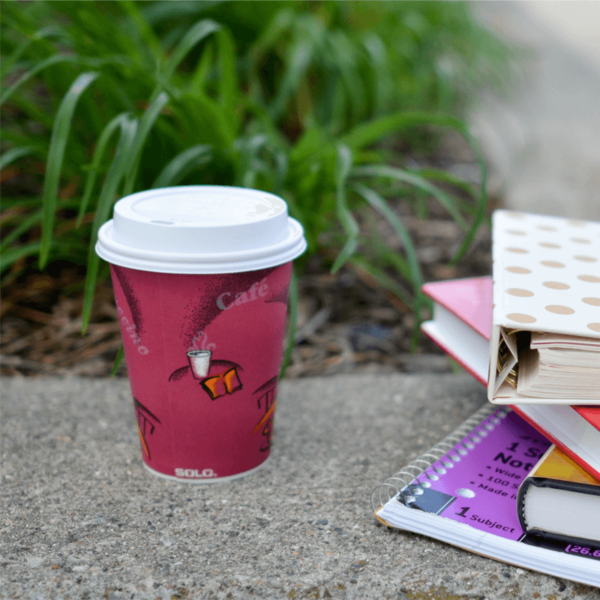 Paper drinks cup with white plastic lid