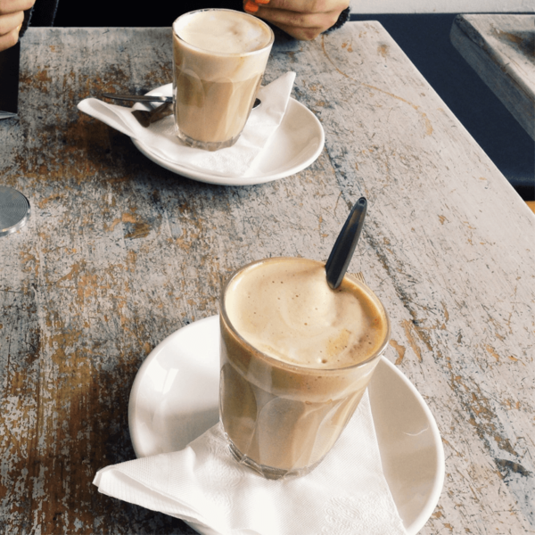 White paper napkin under a latte cup