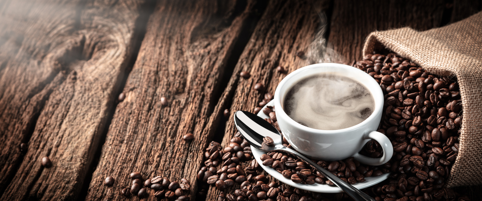 coffee-on-old-table-with-sack-of-beans